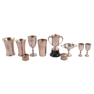 Lot 324 - A collection of eight engraved hallmarked silver golfing trophies, pair of napkin rings.