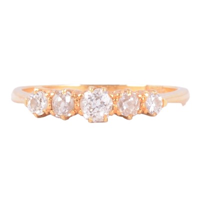 Lot 87 - A diamond half hoop ring.
