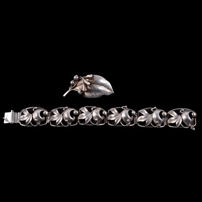 Lot 459 - G Kaplan of Sweden - a white metal bracelet, and similar brooch.