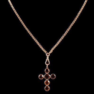 Lot 250 - A citrine cross pendant on a chain.