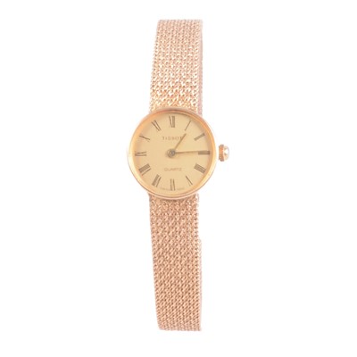 Lot 447 - Tissot - a lady's 9 carat yellow gold quartz bracelet wristwatch.