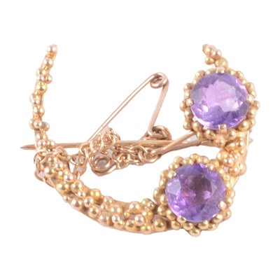 Lot 177 - An amethyst closed crescent brooch.