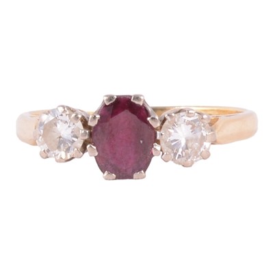 Lot 48 - A ruby and diamond three stone ring.