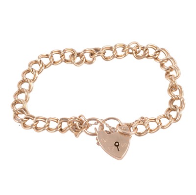 Lot 220 - A 9 carat yellow gold hollow double curb link bracelet.