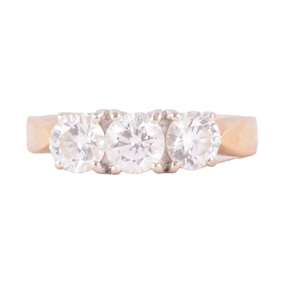 Lot 81 - A diamond three stone ring.