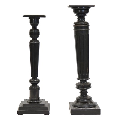 Lot 424 - Two ebonised torcheres