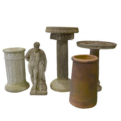 Lot 552 - Concrete garden figure, two bird baths and a chimney pot