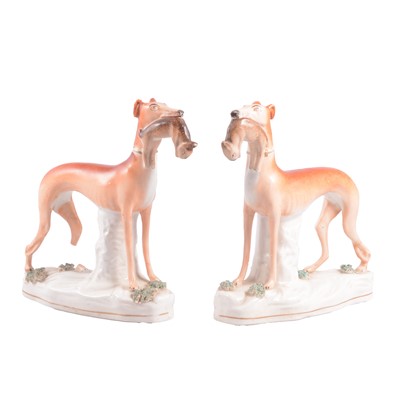 Lot 42 - Pair of Victorian Staffordshire pottery models, greyhounds