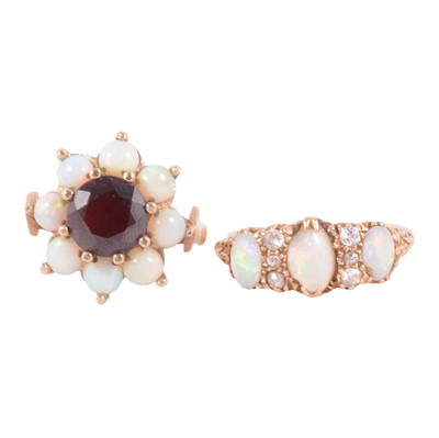 Lot 36 - An opal and garnet cluster ring, and an opal and diamond half hoop ring.