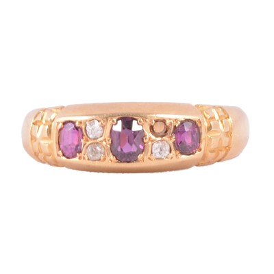 Lot 11 - A ruby and diamond ring.