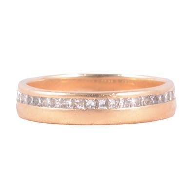 Lot 93 - A diamond half eternity ring.