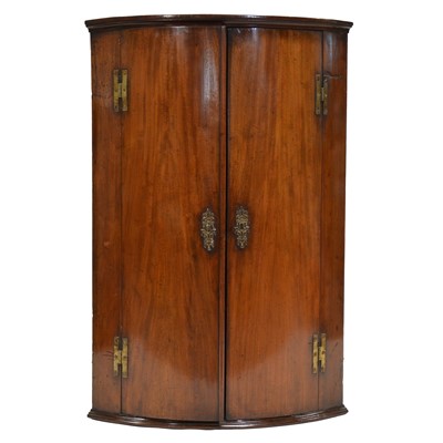 Lot 384 - George III mahogany cylinder front hanging corner cupboard