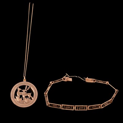 Lot 269 - A yellow metal pendant, yellow metal chain, and yellow metal Greek key bracelet.
