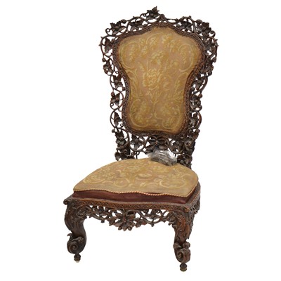 Lot 406 - Anglo-Indian carved hardwood nursing chair