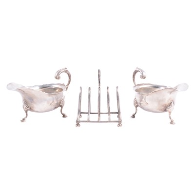 Lot 229 - Pair of silver sauceboats and toast rack