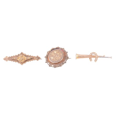 Lot 197 - Two yellow metal bar brooches, and a circular yellow metal brooch.