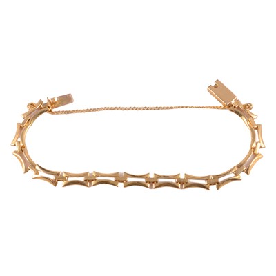 Lot 214 - A yellow metal bracelet.