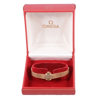 Lot 441 - Omega - a lady's 9 carat yellow gold manual wind bracelet wristwatch.