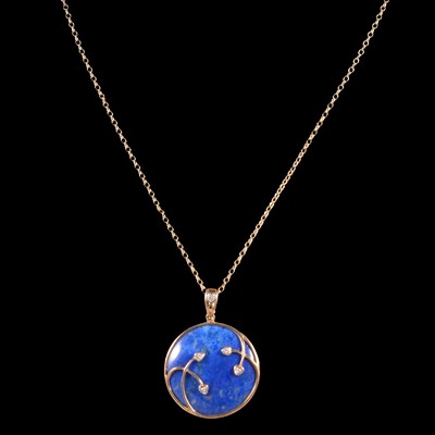 Lot 268 - A lapis lazuli and diamond pendant on a chain.