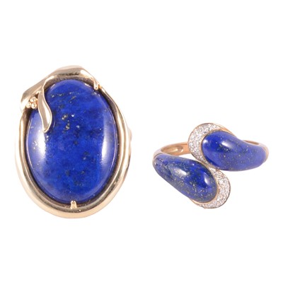 Lot 39 - A lapis lazuli ring, and a lapis lazuli and diamond crossover ring.