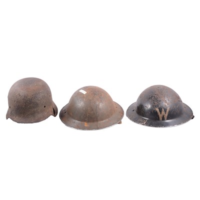 Lot 183 - Three military helmets