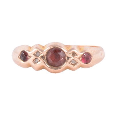 Lot 14 - A garnet and diamond ring.