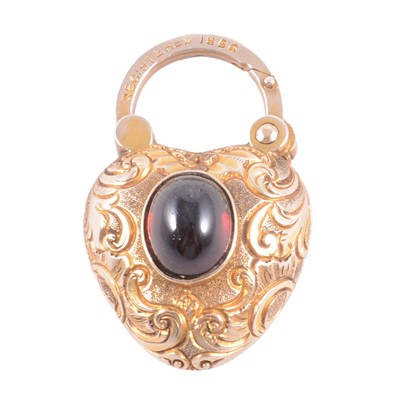 Lot 346 - A Victorian yellow metal garnet set padlock.