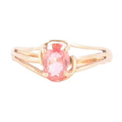 Lot 8 - A Padparadscha sapphire solitaire ring.