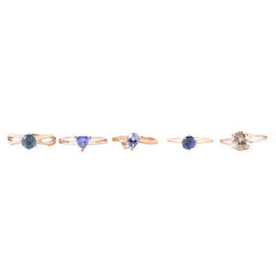 Lot 56 - Five gemset solitaire gold rings, peridot, tanzanite and indicolite.