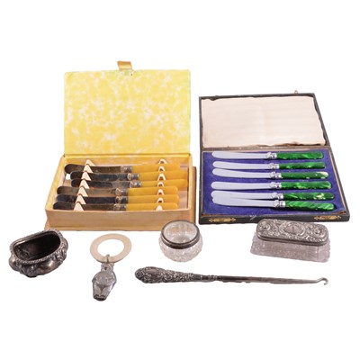 Lot 246 - Silver topped glass dressing table jars, salts, button hook, cased plated flatware and a teddy teething ring.