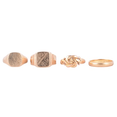 Lot 127 - A gold wedding band, two gold signet rings, and a yellow metal knot ring.