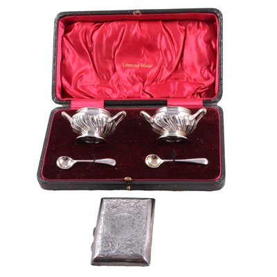 Lot 244 - A cased set of silver salts with spoons, a silver cigarette case.