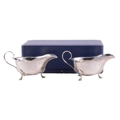 Lot 243 - A pair of silver sauce boats, Mappin & Webb, Sheffield 1963, cased.