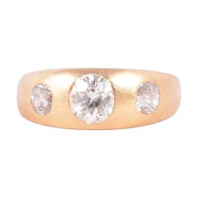 Lot 113 - A diamond three stone ring in a gentleman's style.