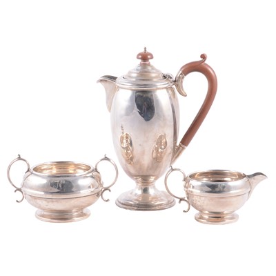 Lot 246 - A silver coffee pot and milk and sugar Birmingham 1939/1931.