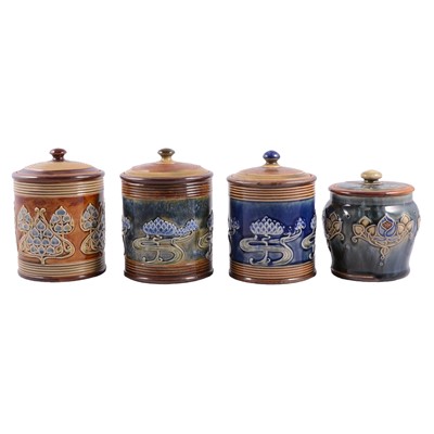 Lot 104 - Four Doulton Lambeth stoneware Art Nouveau tobacco jars