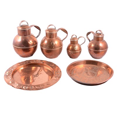 Lot 100 - Arts and Crafts copper plate, another plate, and set of four graduated jugs