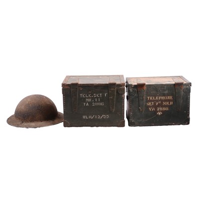 Lot 86 - Two military field telephone sets and World War I helmet
