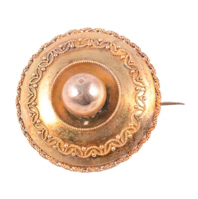 Lot 196 - A Victorian yellow metal Etruscan style target brooch in a velvet jewel box.