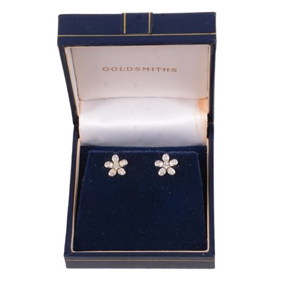 Lot 238 - A pair of floral design diamond cluster earstuds.