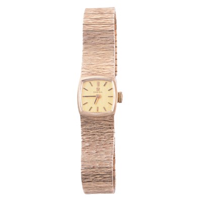 Lot 440 - Omega – a lady’s 9 carat yellow gold manual wind bracelet wristwatch.