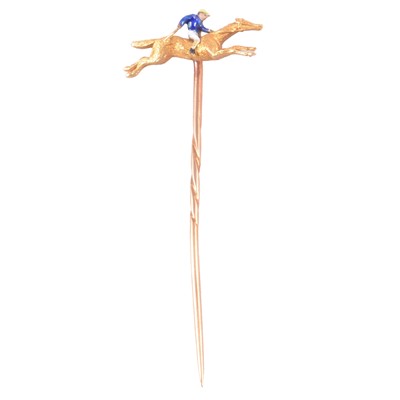Lot 363 - A yellow metal horse and jockey stick pin.