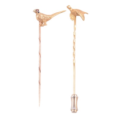 Lot 373 - Two yellow gold game bird stick pins.