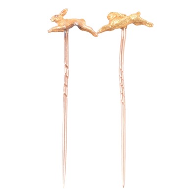 Lot 368 - Two yellow metal running hare stick pins.