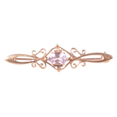 Lot 180 - An amethyst bar brooch.