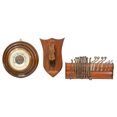 Lot 73 - Edwardian oak aneroid barometer, deer hoof trophy and rack of hunting spurs