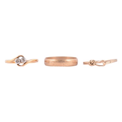Lot 50 - A diamond two stone ring, gold wedding band and another gold ring.