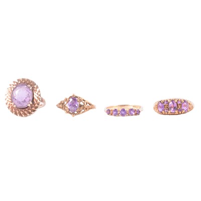 Lot 53 - Four amethyst dress rings.