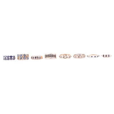 Lot 62 - Six sapphire half hoop rings, and two eternity rings.