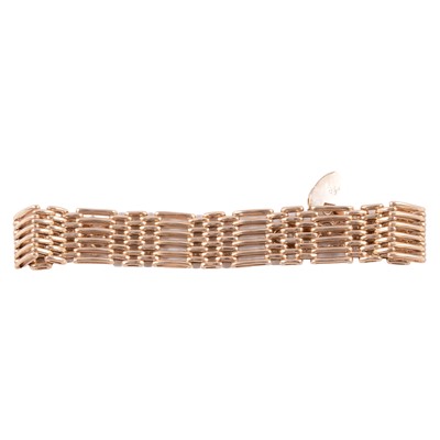 Lot 226 - A 9 carat yellow gold six bar gate link bracelet.